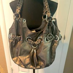 Michael Kors woman’s vintage metallic handbag with woven handles gently  used